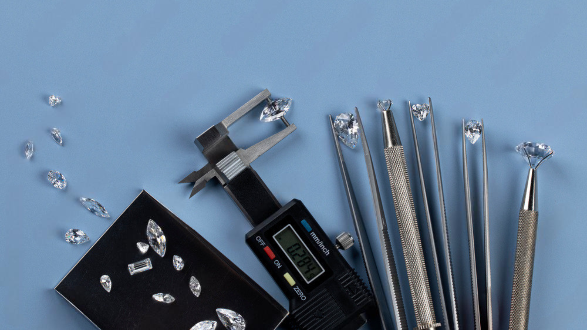 Diamond appraisal tools including a digital scale, gemstones, and diamond lathes on a blue background.